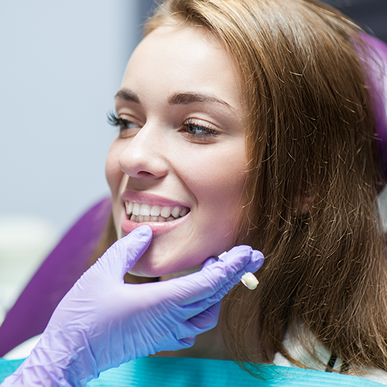 Woman smiling at her dentist