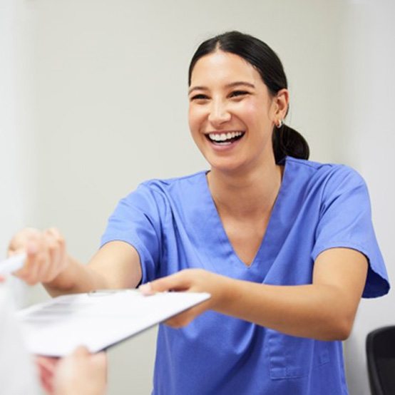 Doctor taking notes during patient’s consultation