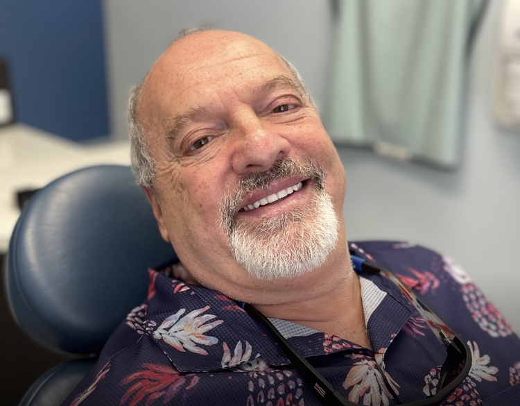 Senior man smiling in dental chair