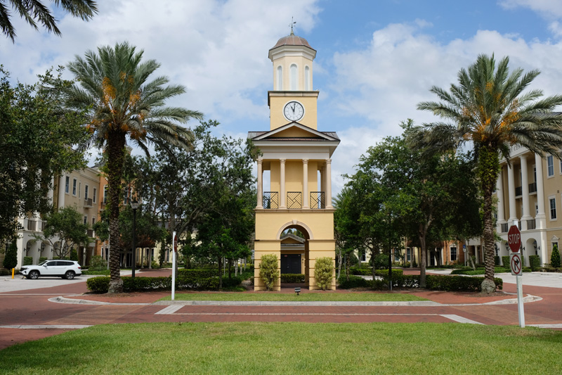 Small clock tower in plaza near dental office in Jupiter