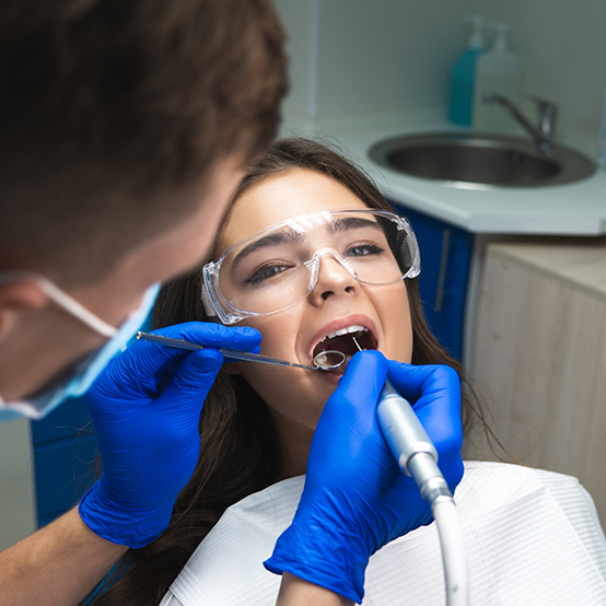 Woman receiving root canal treatment in Jupiter