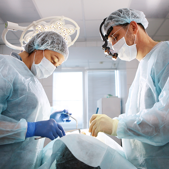 Dentist and assistant performing a dental procedure