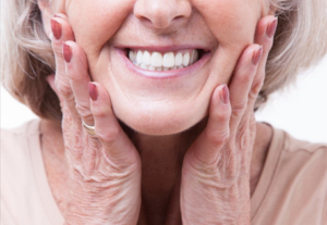 Woman holding her face and smiling